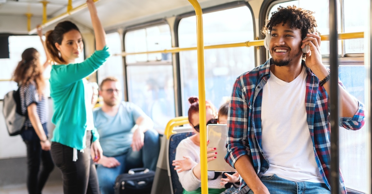 multi ethnic people riding public transport