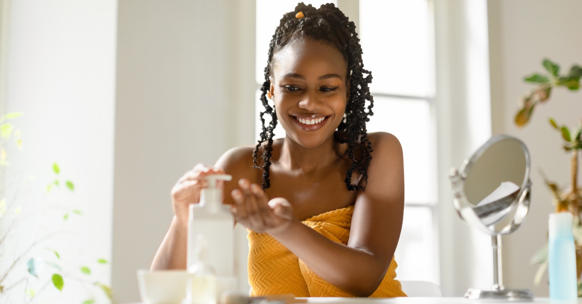 woman pouring moisturising body lotion