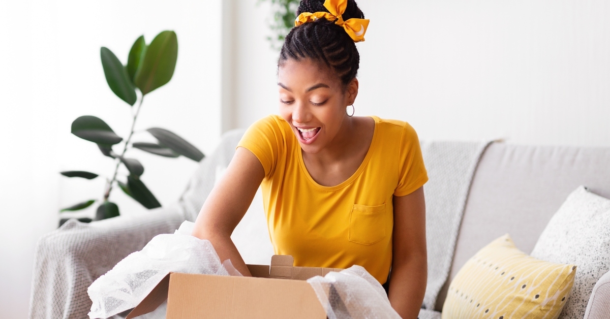 black woman unpacking parcel
