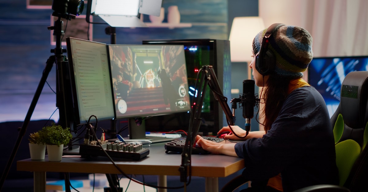 female gamer live streaming using computer