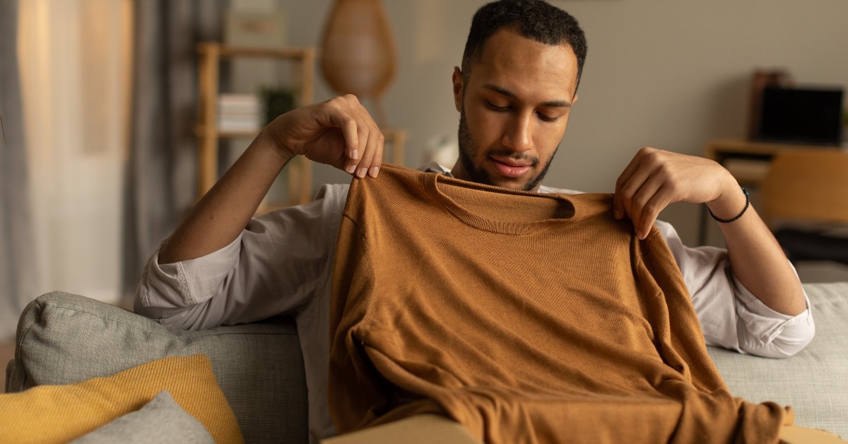african american man unpacking order