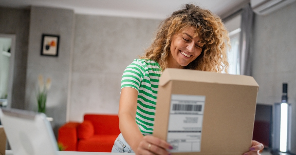 woman opens package box