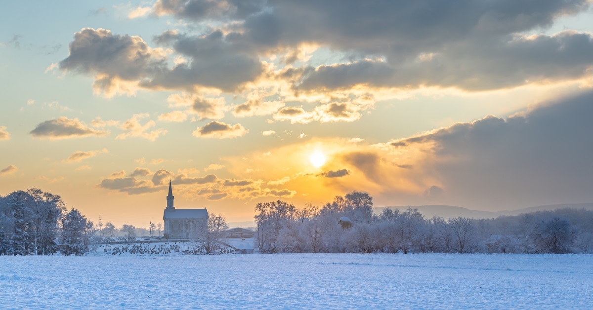 winter sunrise over rural church