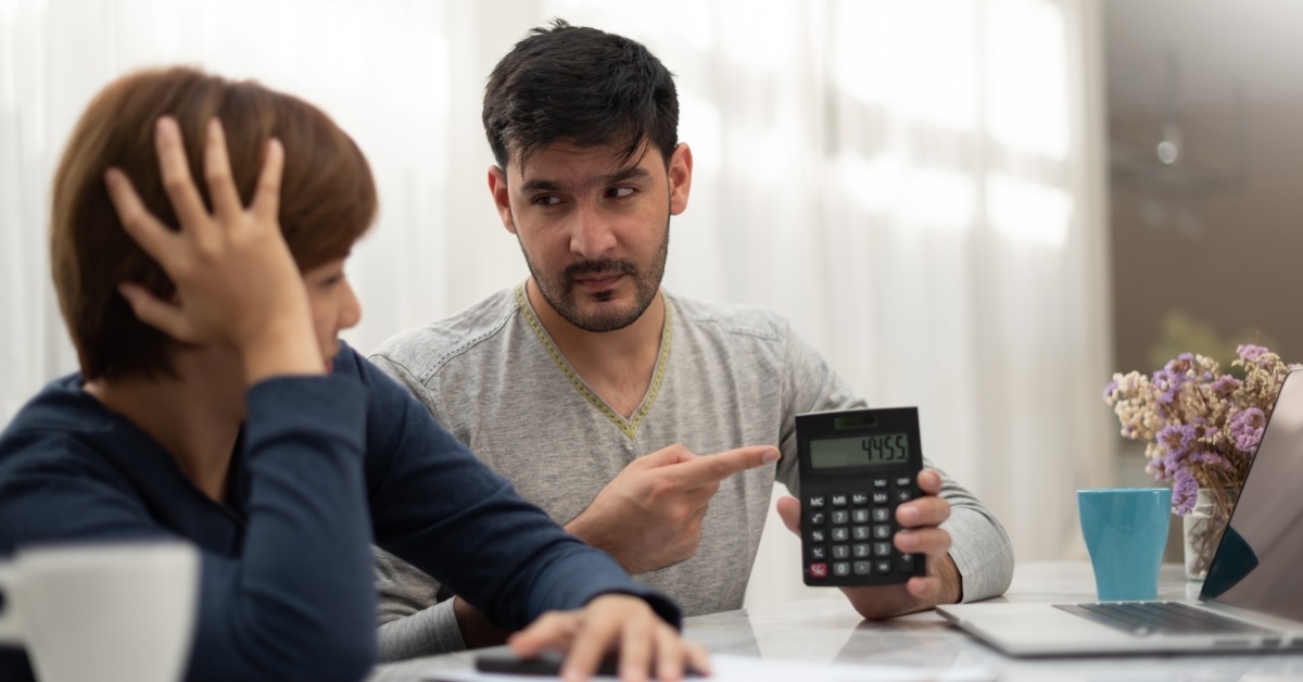 Couple arguing about bills at home