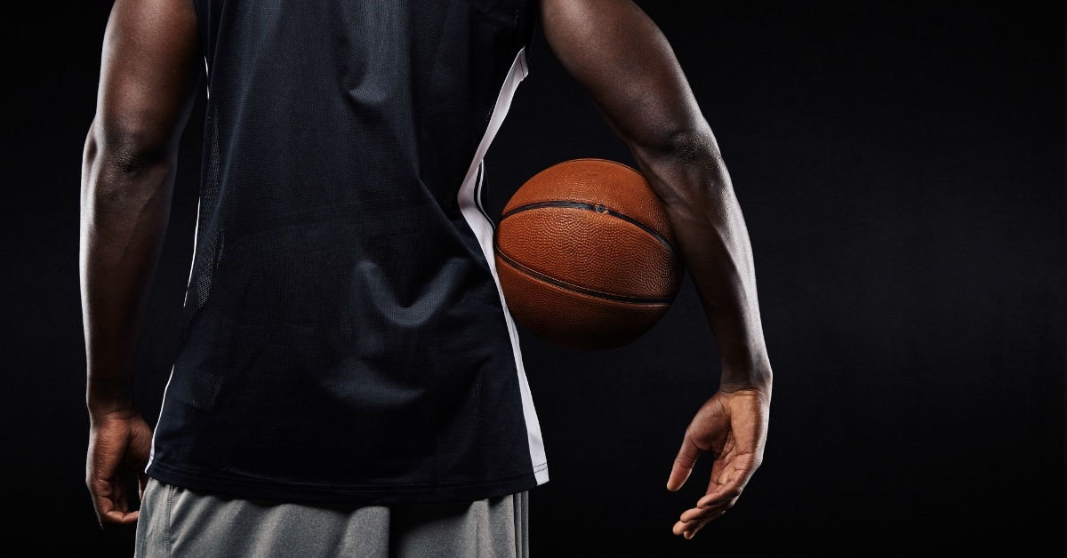 basketball player with ball in arm