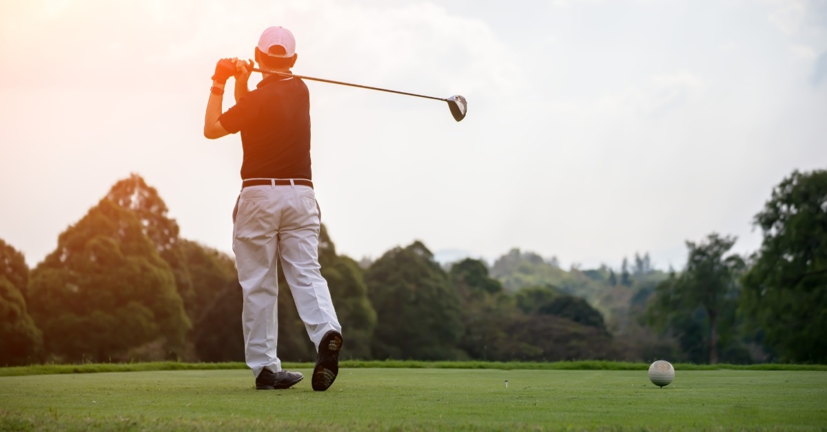 golfer hitting swing shot on field