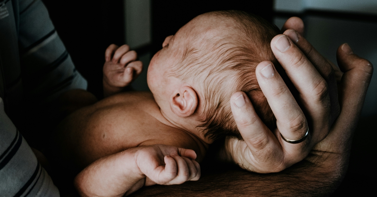 man holding a baby
