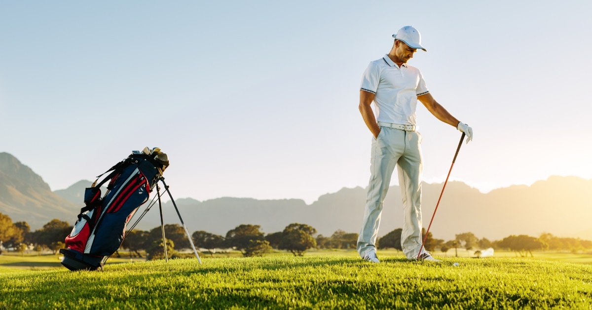 professional male golfer standing on field