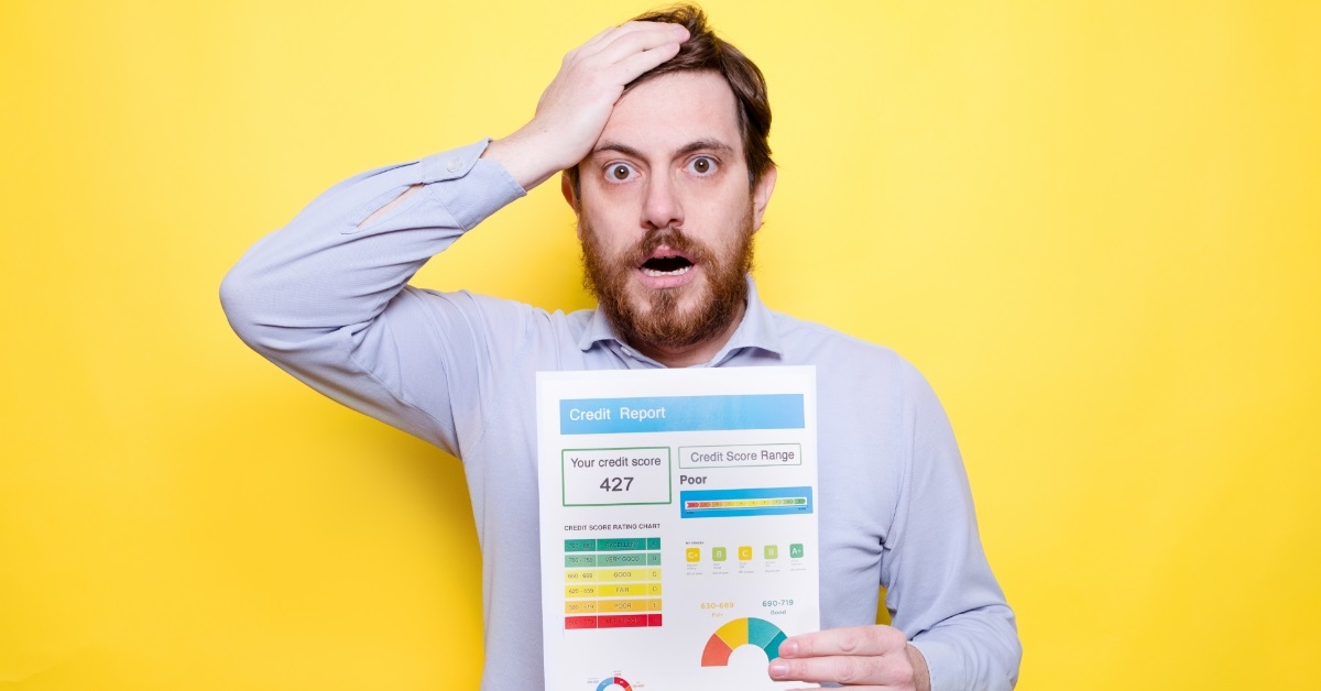 man frustrated at poor credit score