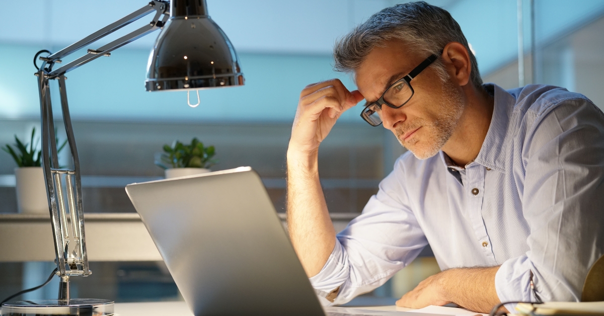 thoughtful in front of laptop
