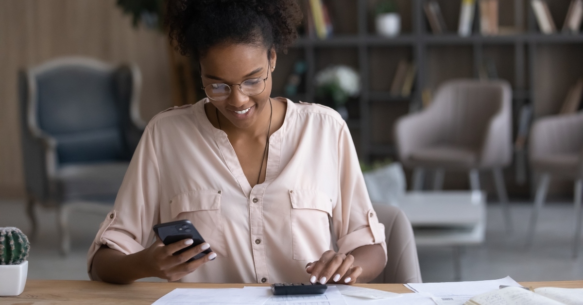 woman in glasses calculating bills