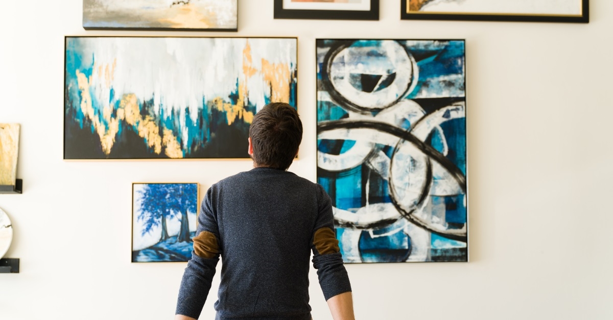 guy admiring art at exhibition