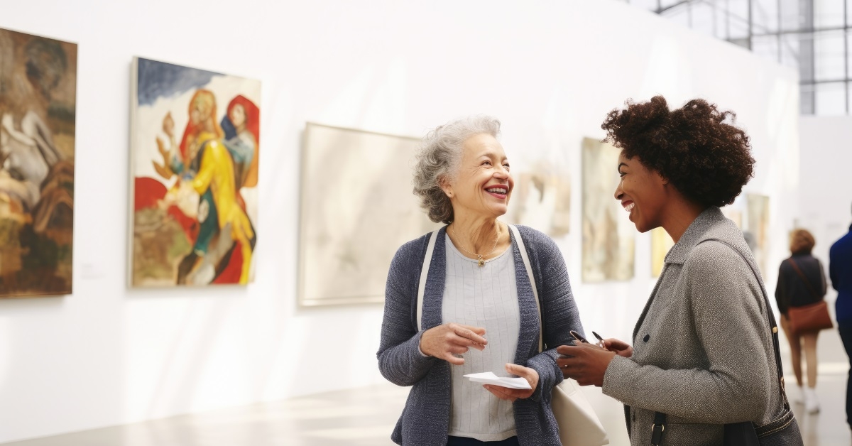senior woman discussing art with friend