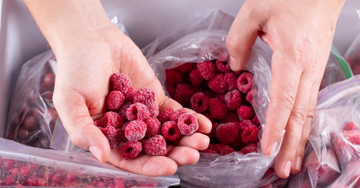 hand full of frozen raspberries