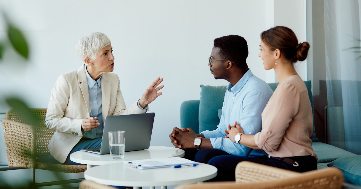 mature financial adviser using laptop