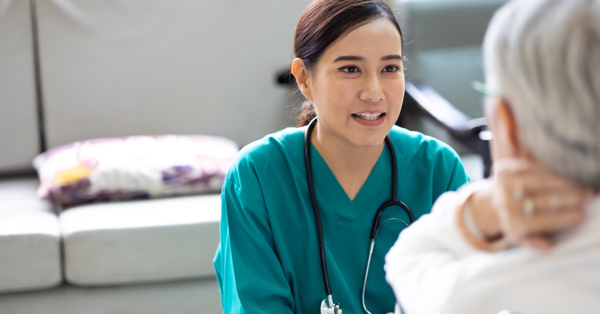senior patient with happy female doctor