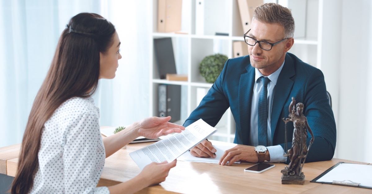 male lawyer discussing papers with client