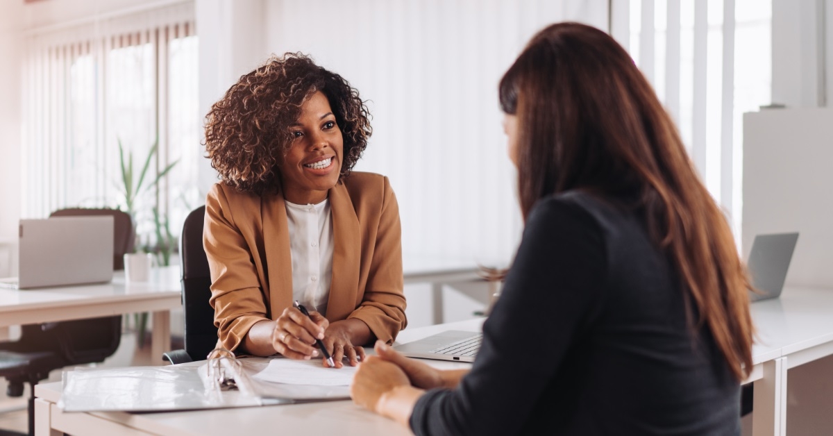 woman consulting female finance manager