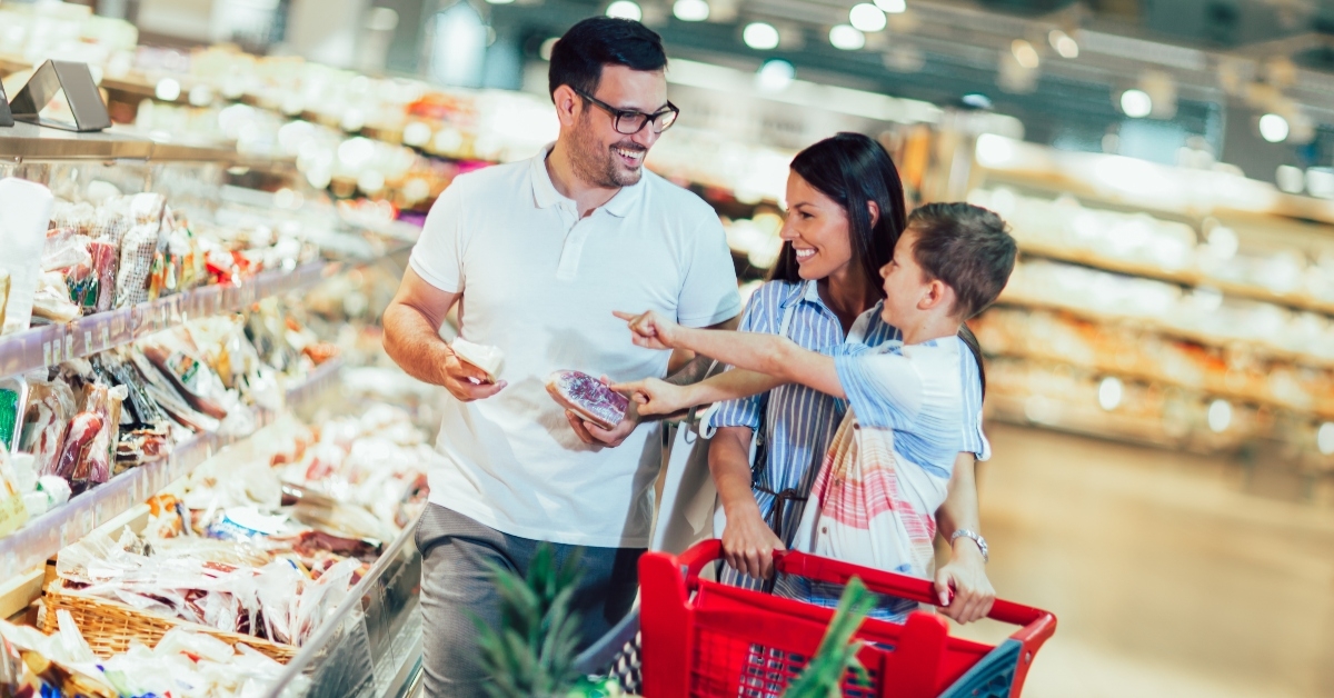 family buying food at grocery store