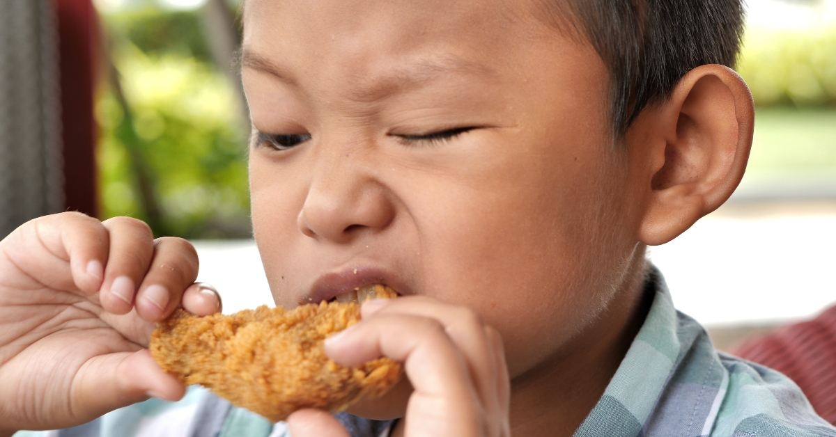 happy eating fried chicken leg
