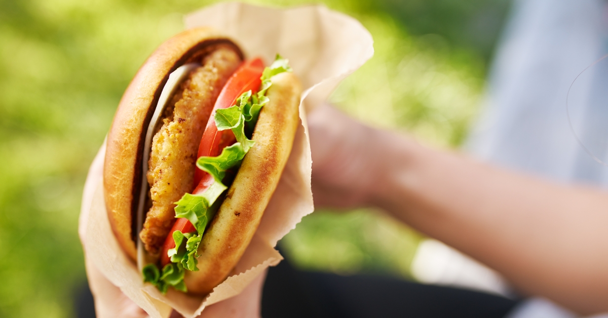 woman holding crispy chicken sandwich
