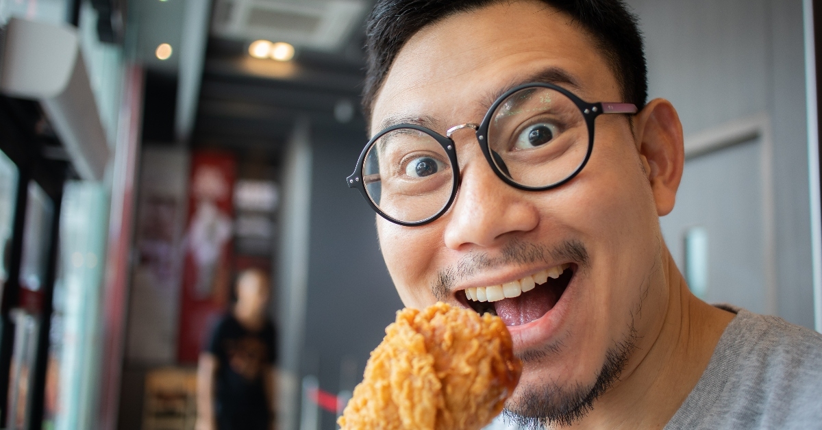 A man eating chicken