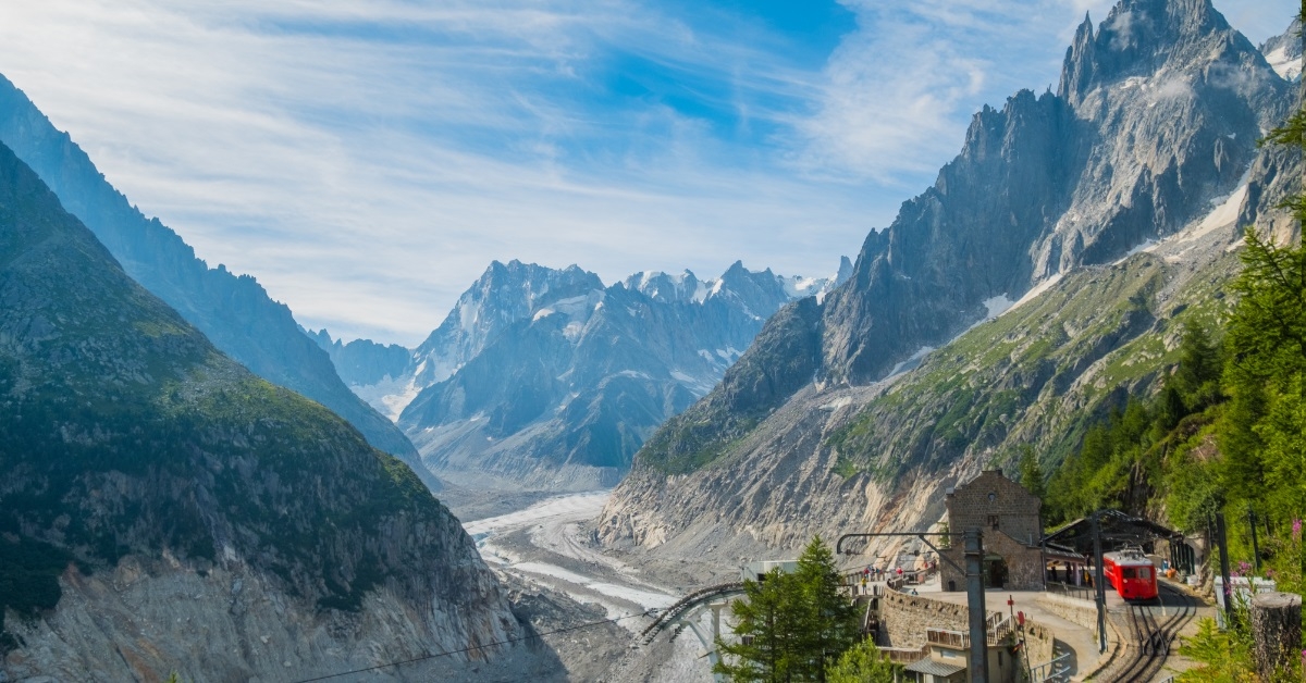 hilly train station with mountains