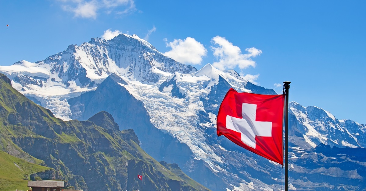 swiss flag with snowy mountains