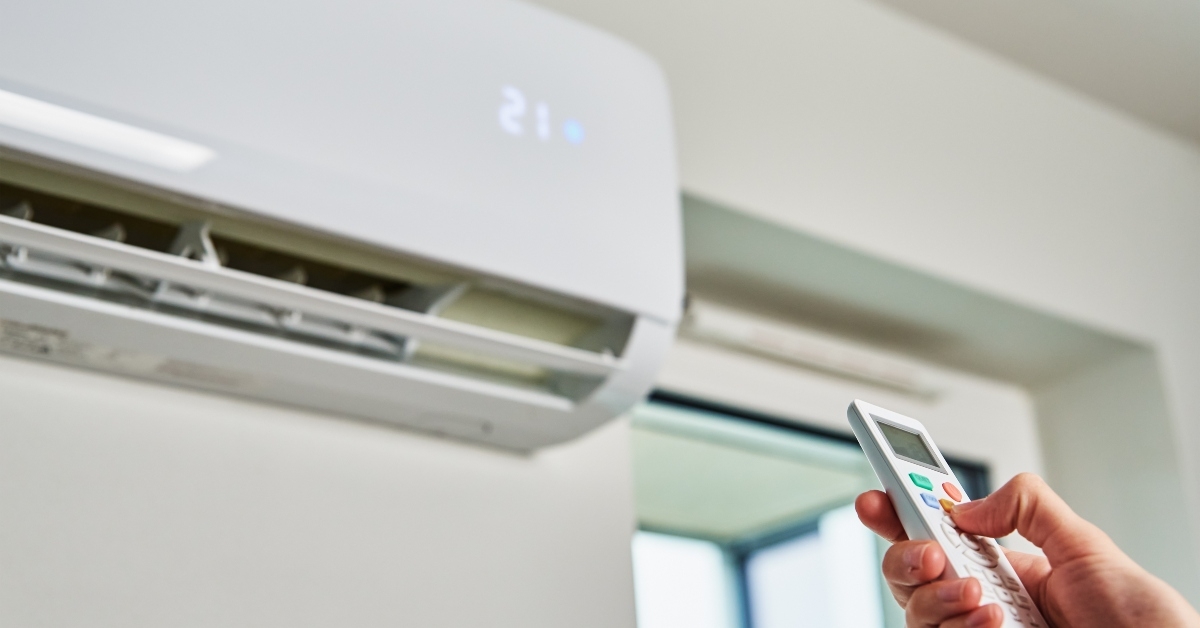 adjusting temperature on air conditioner