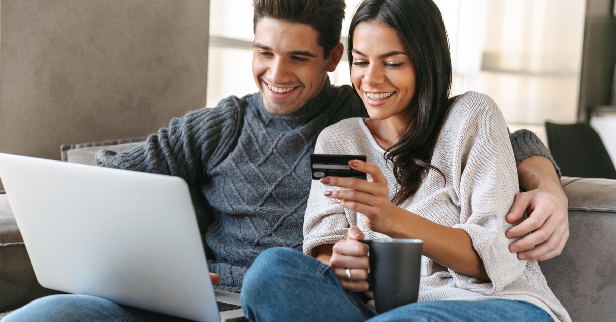 young couple sitting on a couch
