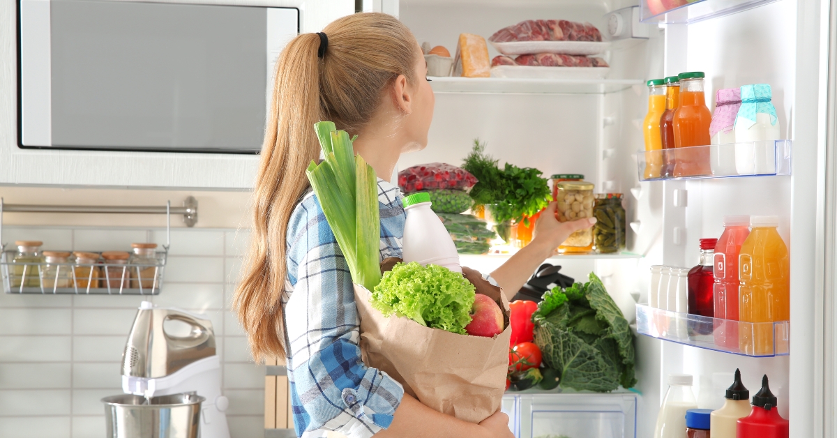 woman putting away groceries