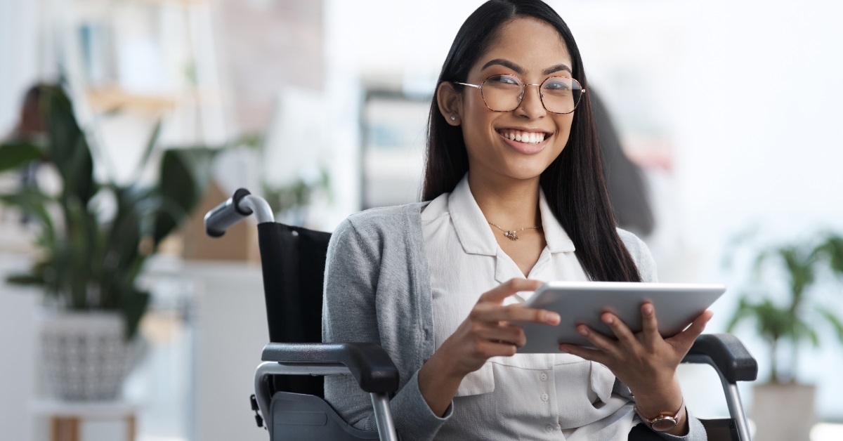 disabled female web designer using tablet