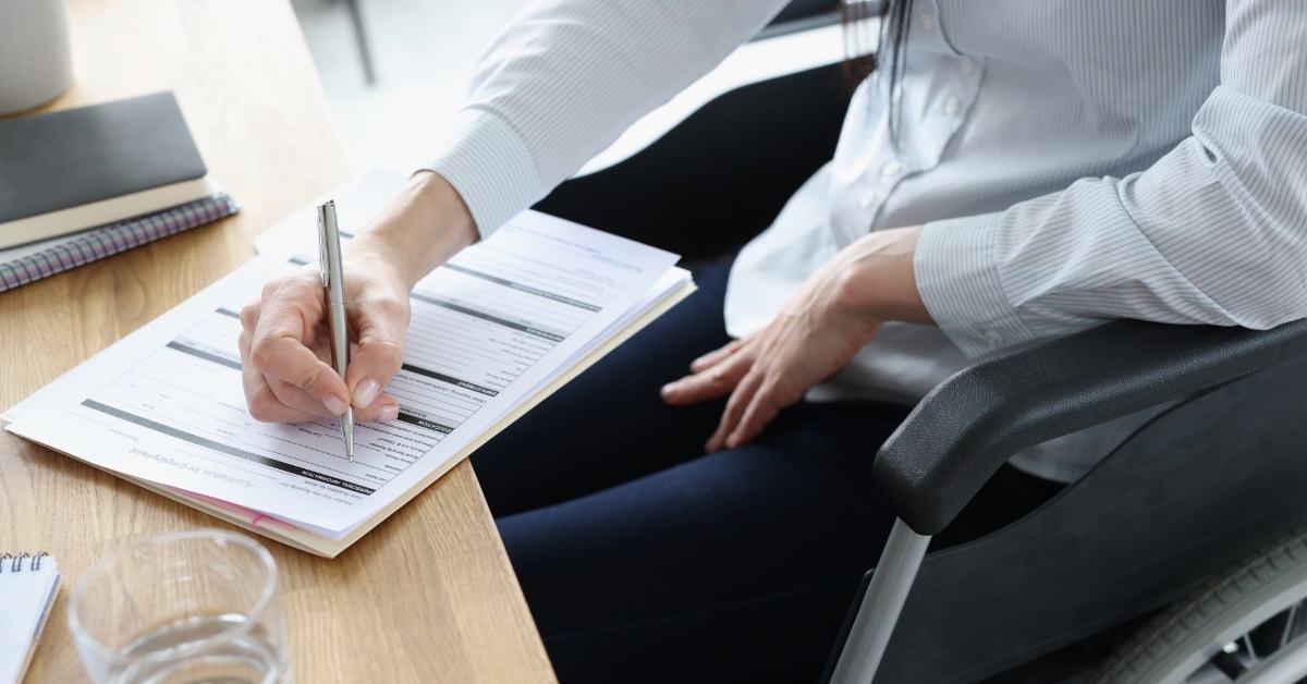 disabled woman filing employment form