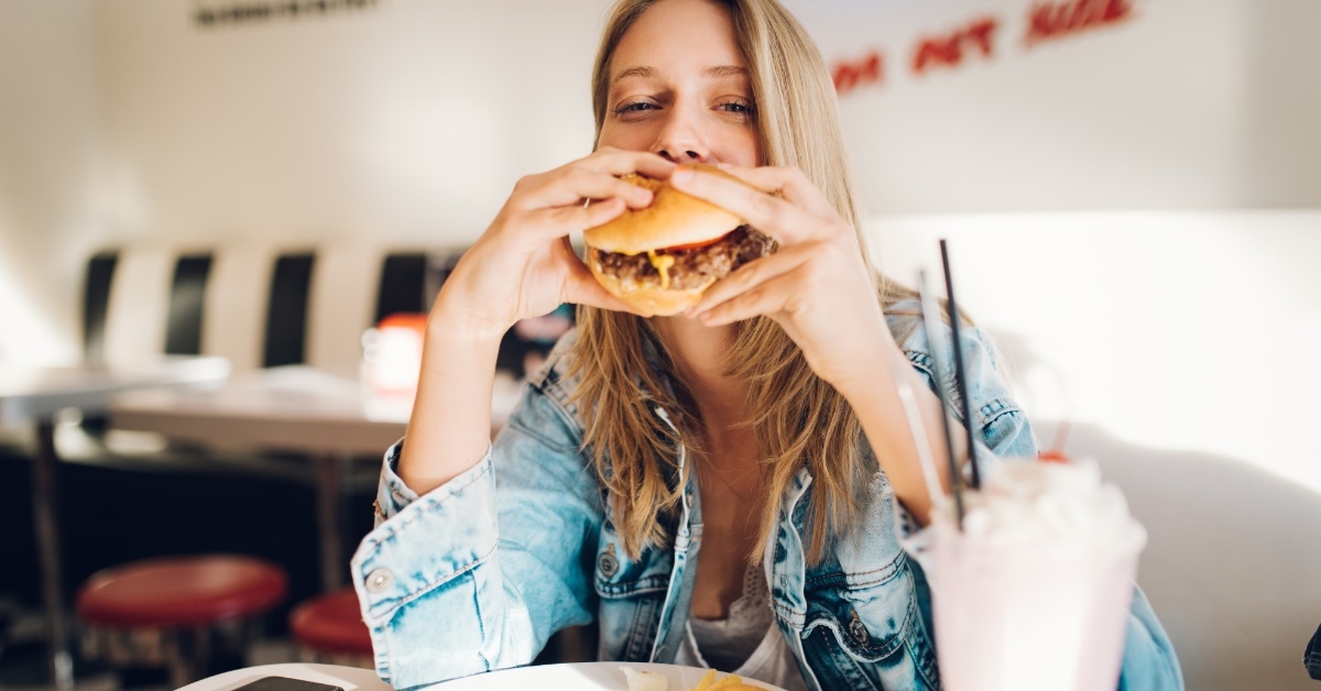 attractive woman eating burger