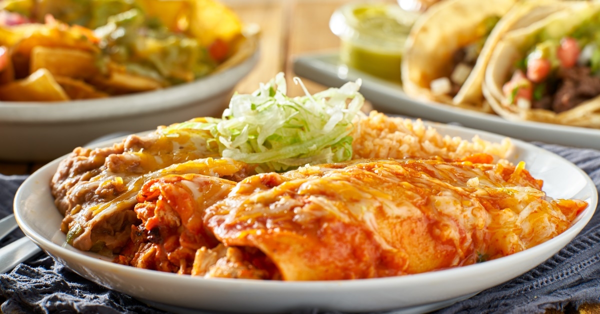 mexican enchilada platter with red sauce