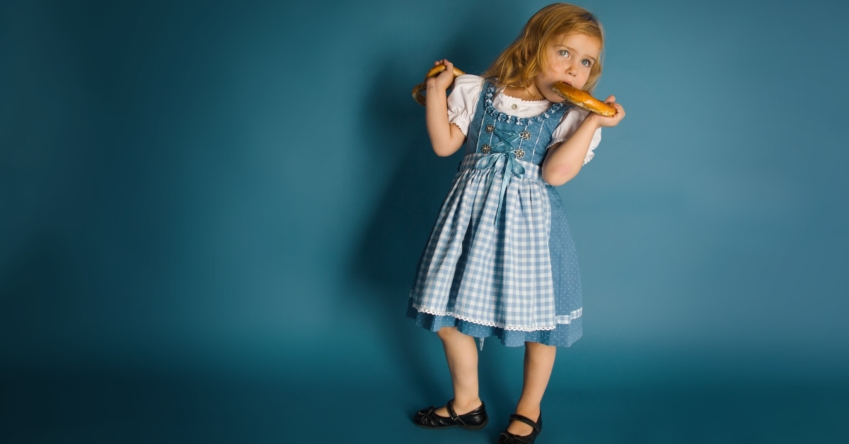 little german girl eating pretzel