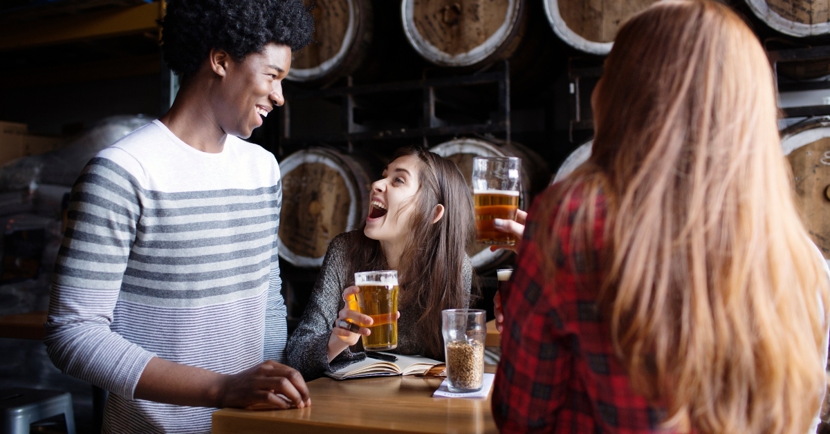 friends enjoying beer in brewery