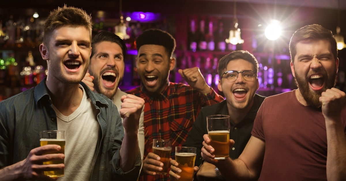 happy men holding beer mugs 