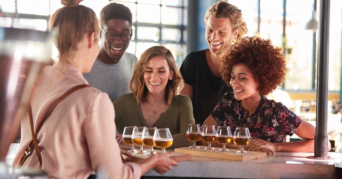 waitress serving group of friends