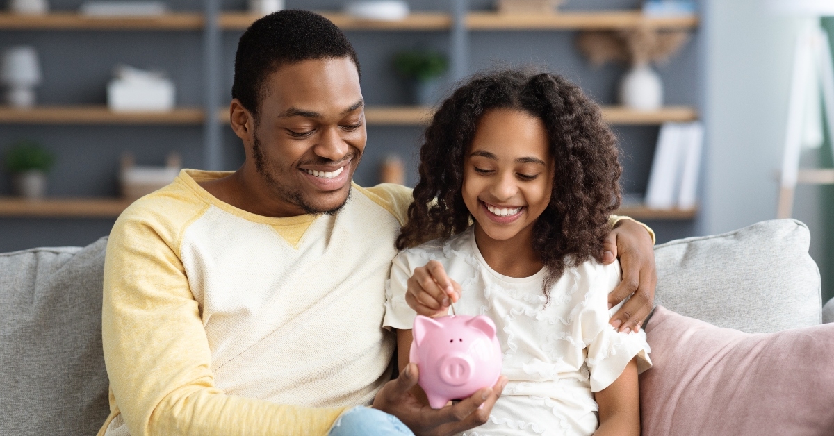 putting coin into piggy bank