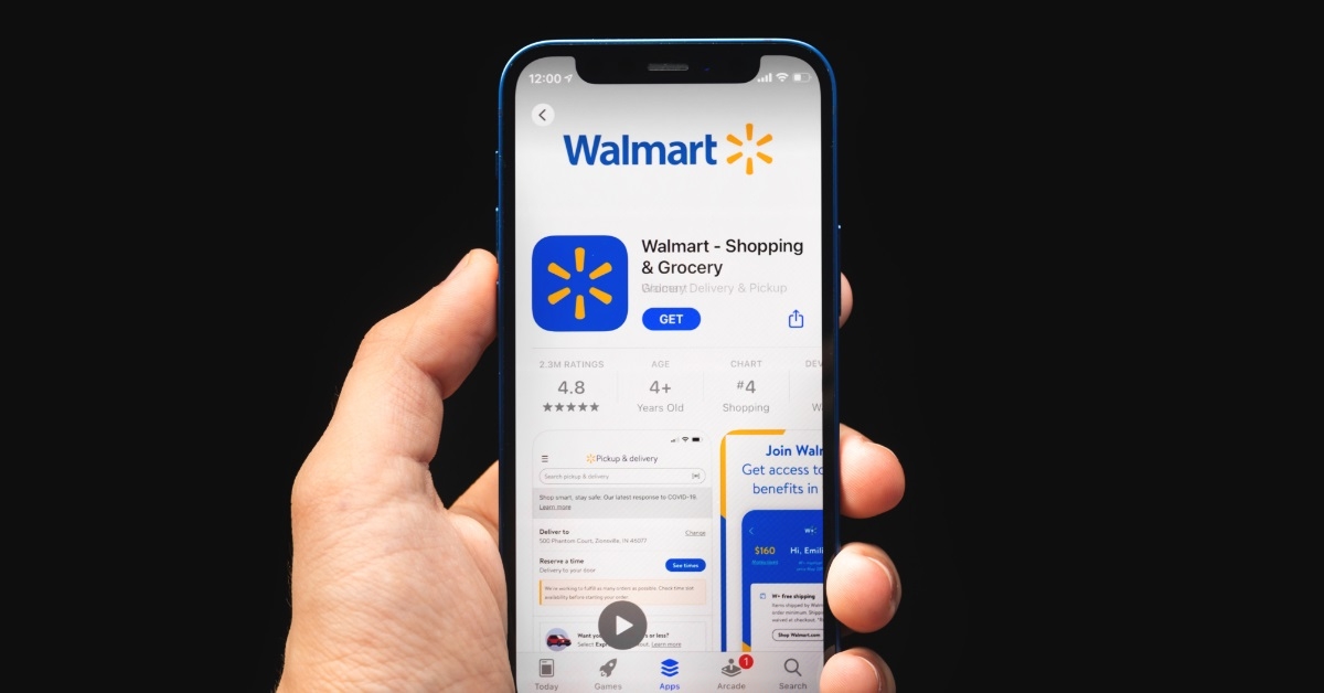 hand holding smartphone with walmart app