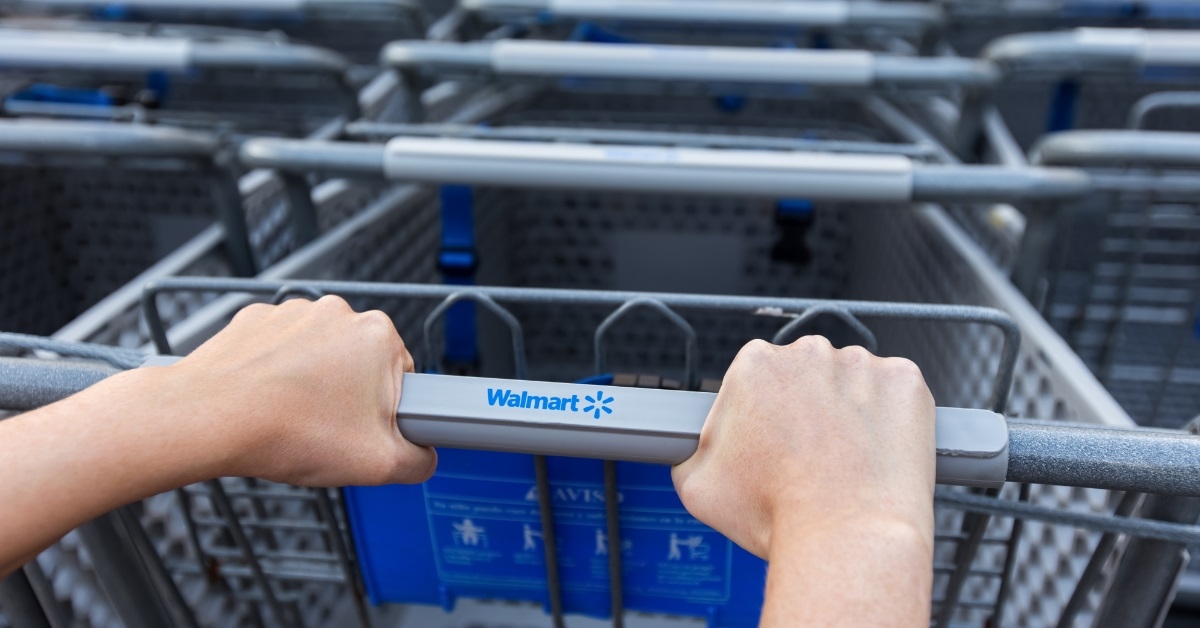 woman taking shopping cart at walmart