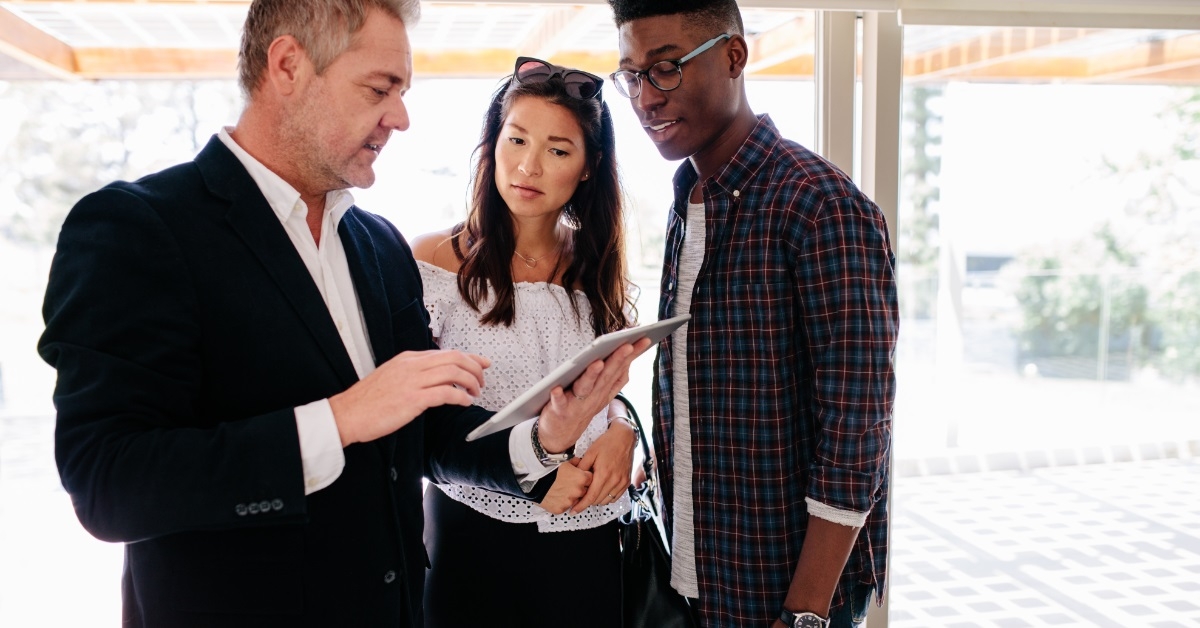 multi ethnic couple consulting realtor
