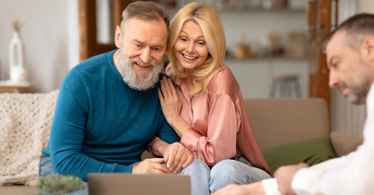 senior couple consulting male realtor