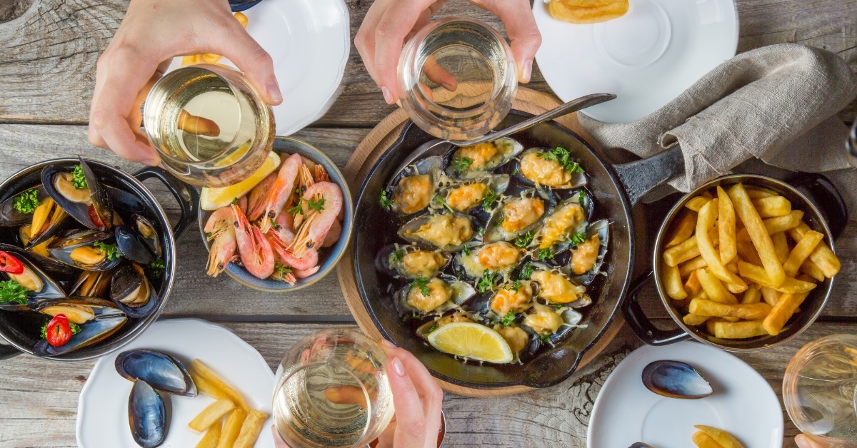 family having summer lunch with seafood