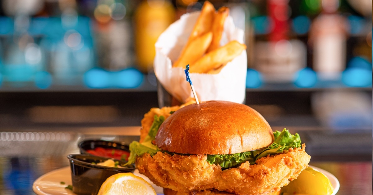 fish burger with fries and ketchup