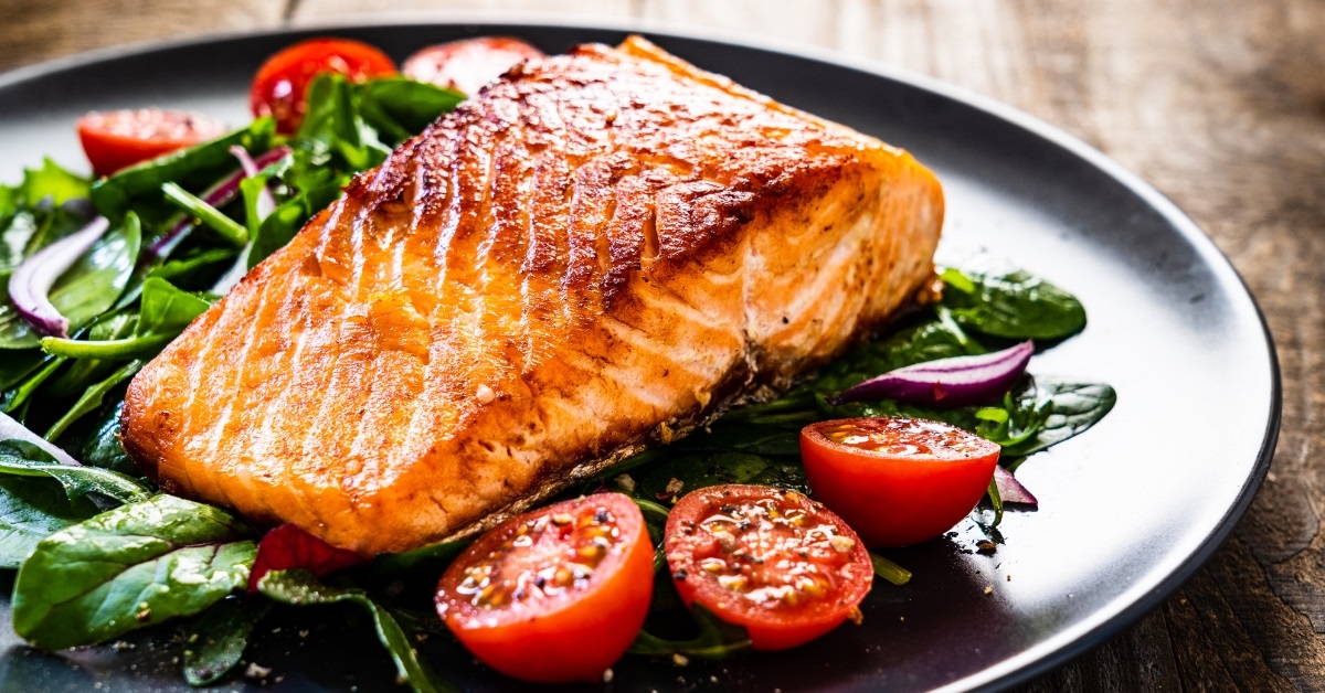 fried salmon steak plate with vegetables