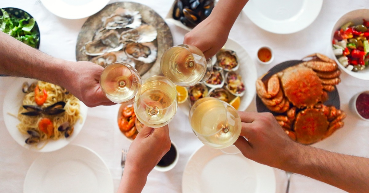 friends toasting wine at restaurant
