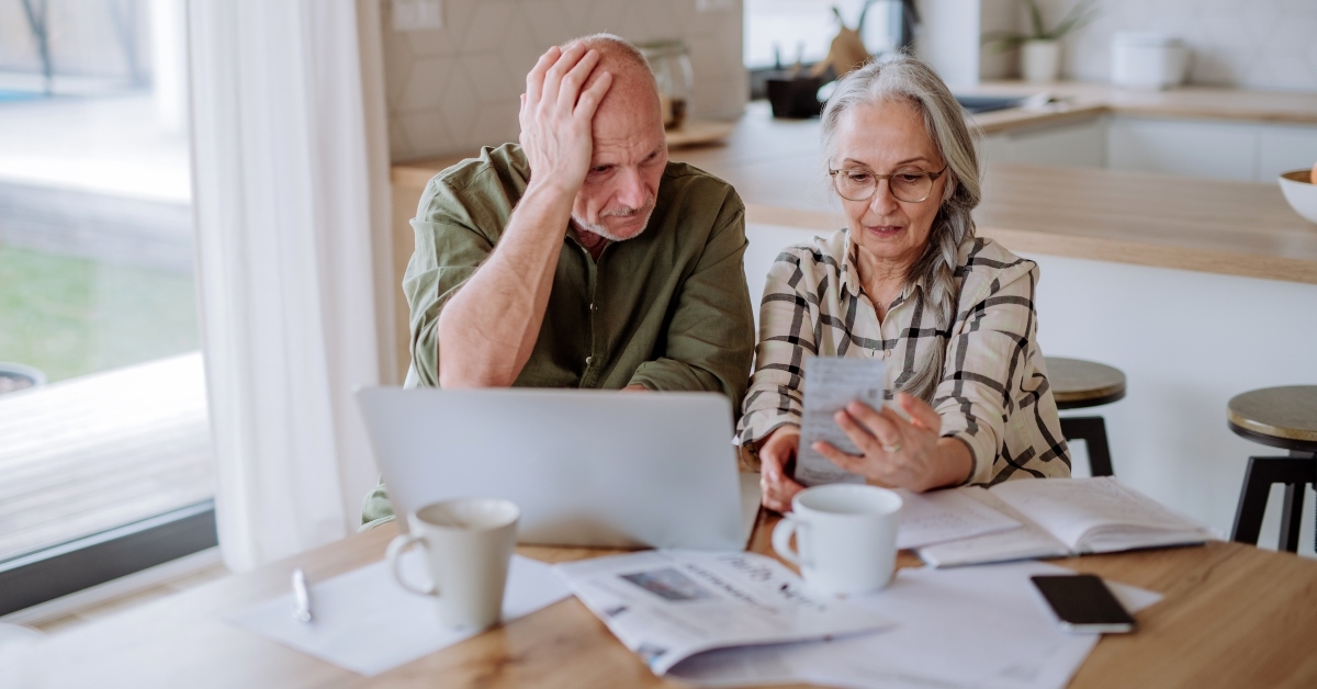 senior couple calculate expenses 