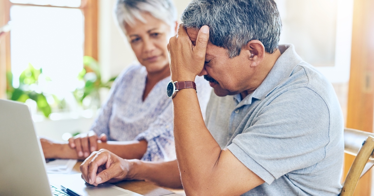 senior couple with worry for bills,